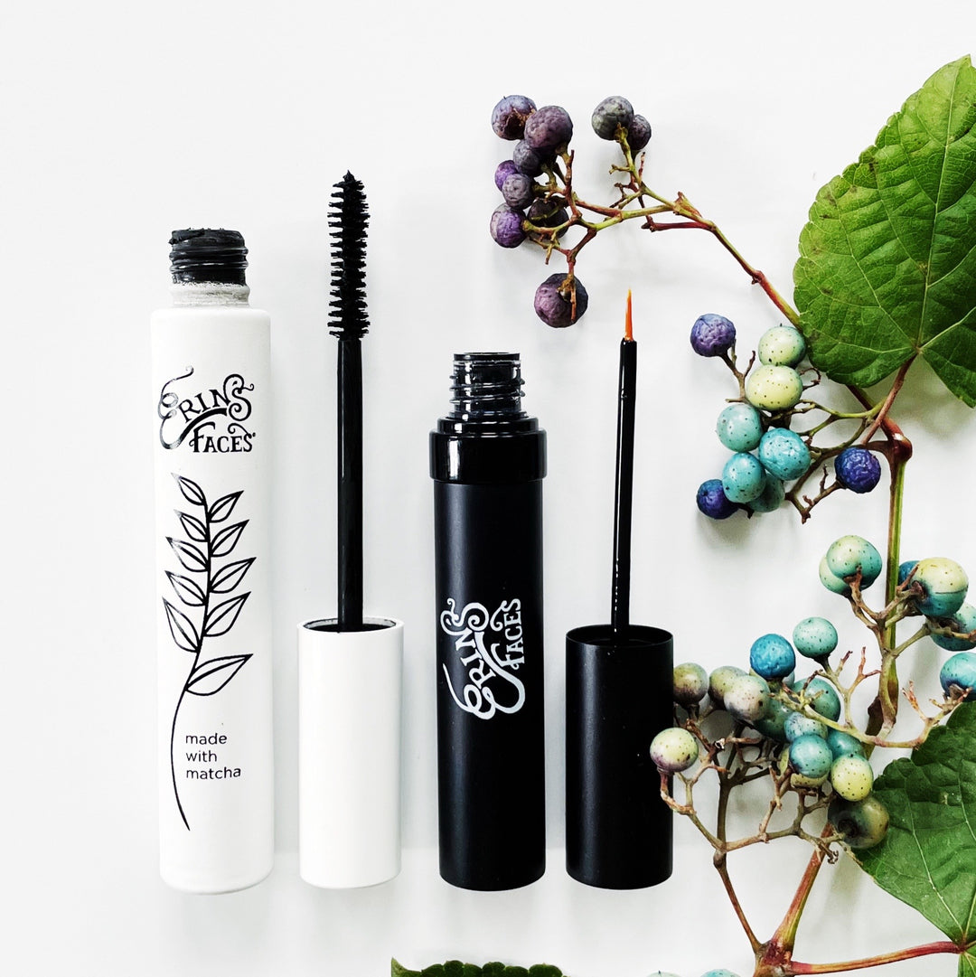 erin's faces matcha mascara and lash serum  next to vine with blue berries