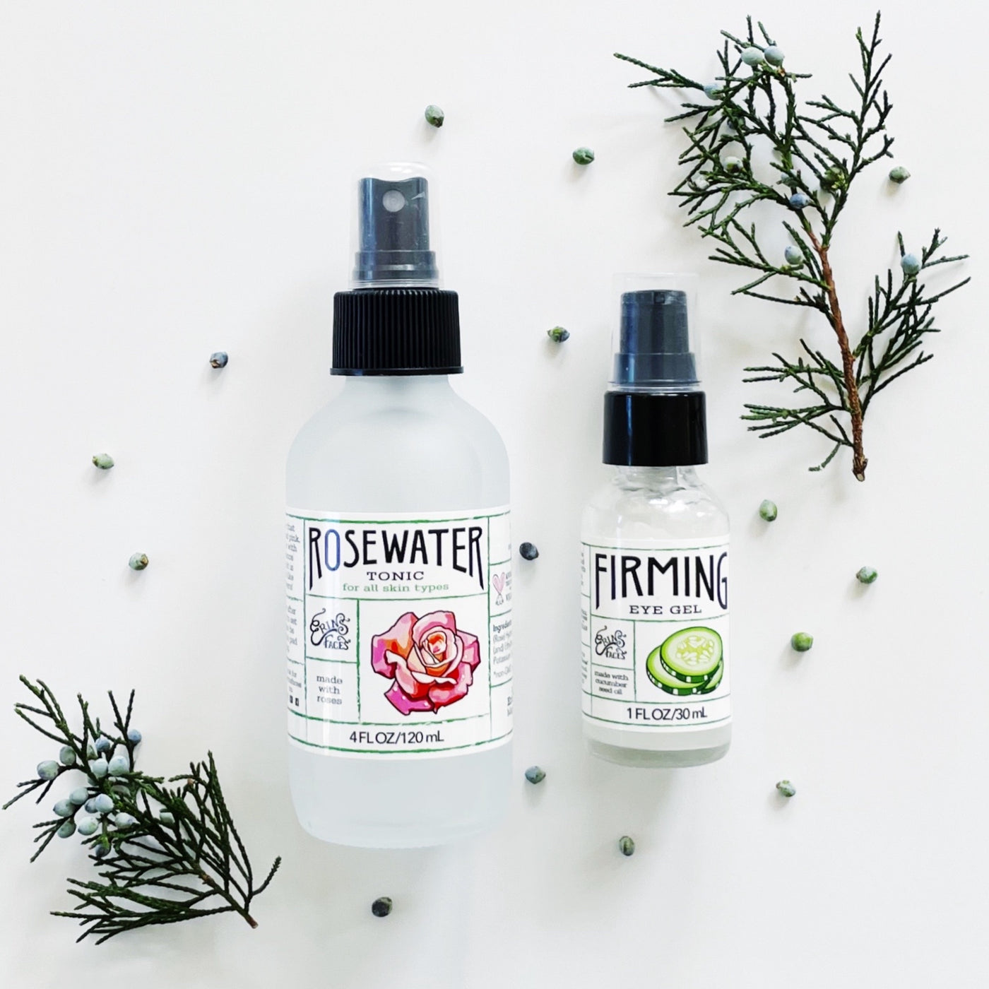 bottles of erin's faces rosewater tonic and firming eye gel and juniper berries