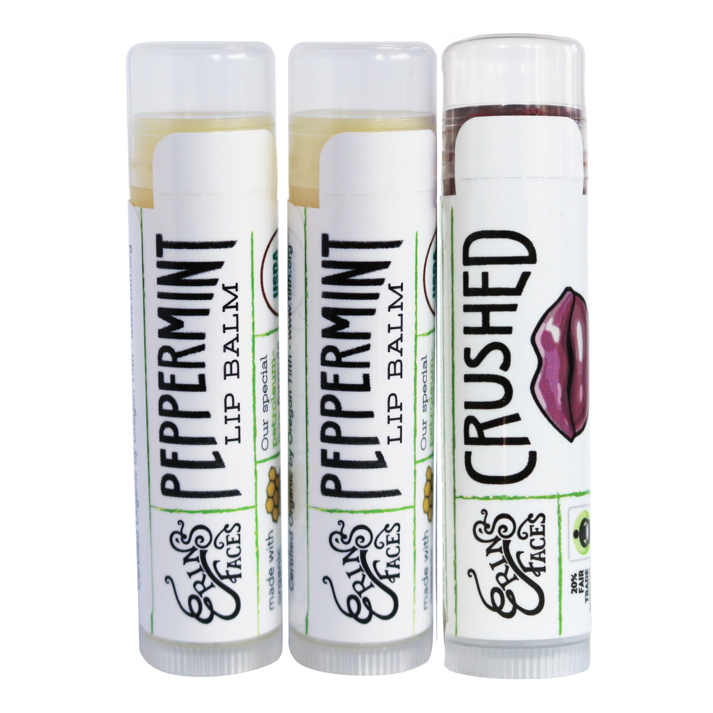 two peppermint lip balms - clear - and one tinted lip balm in crushed with mauve lips on the tube