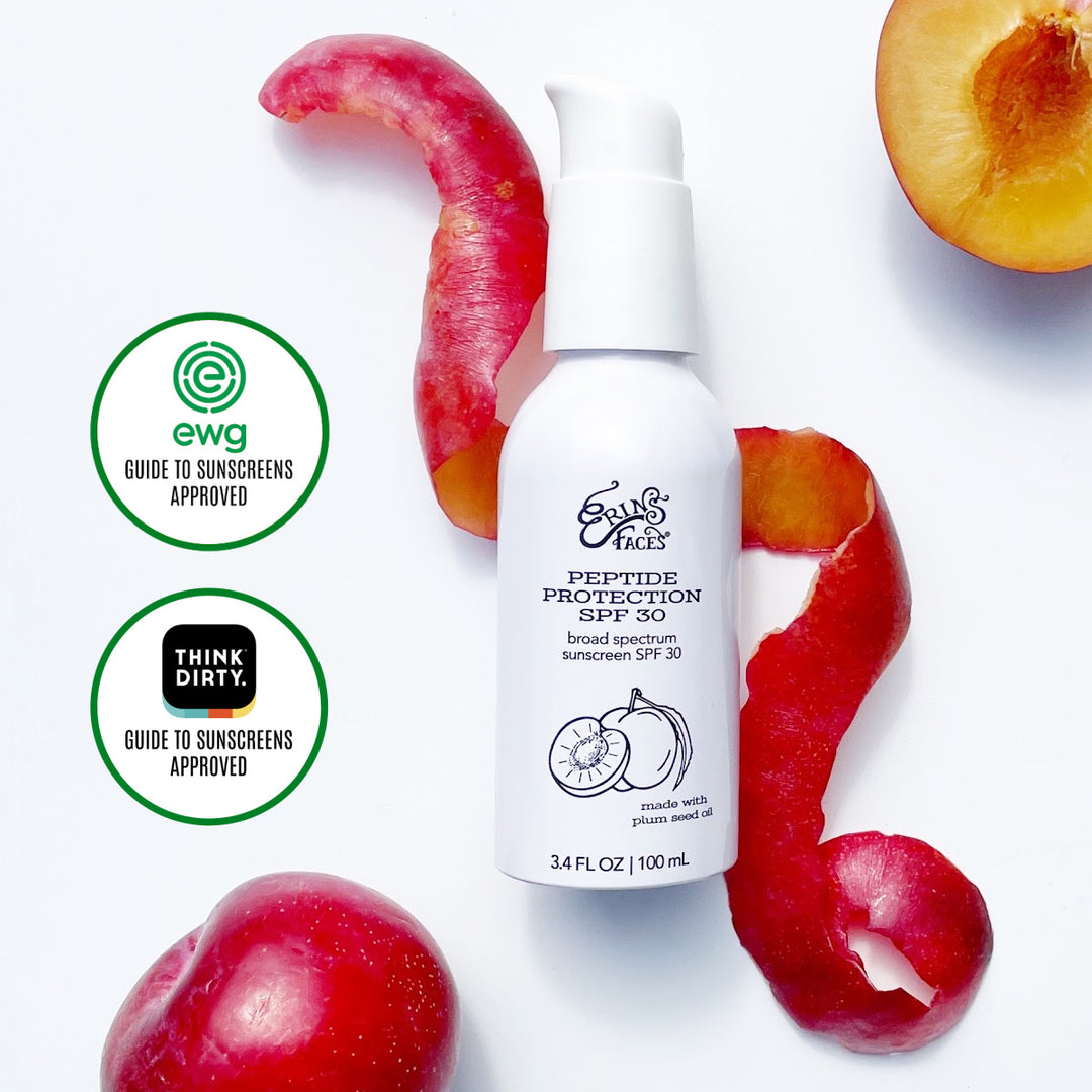 erin's faces peptide protection spf 30 bottle with a plum peel twirled around the bottle on white background - bottle is white too - slice of plum in photo as well + ewg guide to sunscreens approved graphic