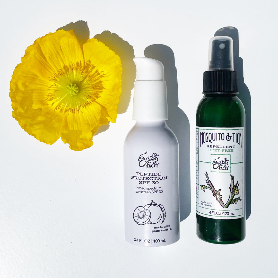 daily facial mineral spf white bottle with mosquito repellent green bottle on white background with yellow flower