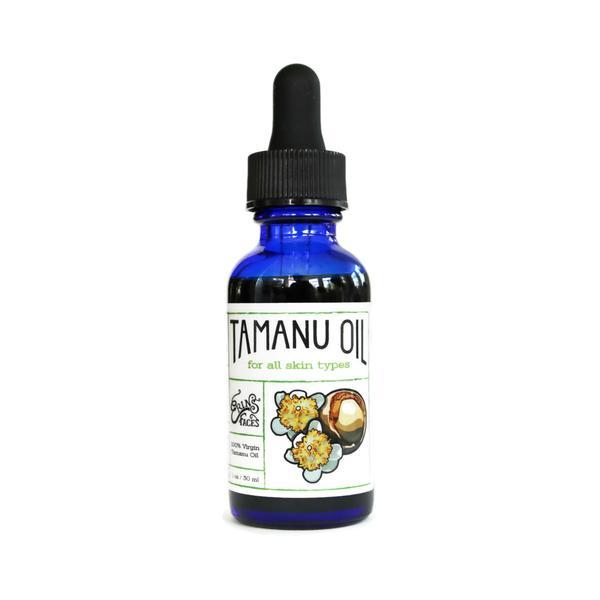 Blue bottle of Tamanu Oil with white label