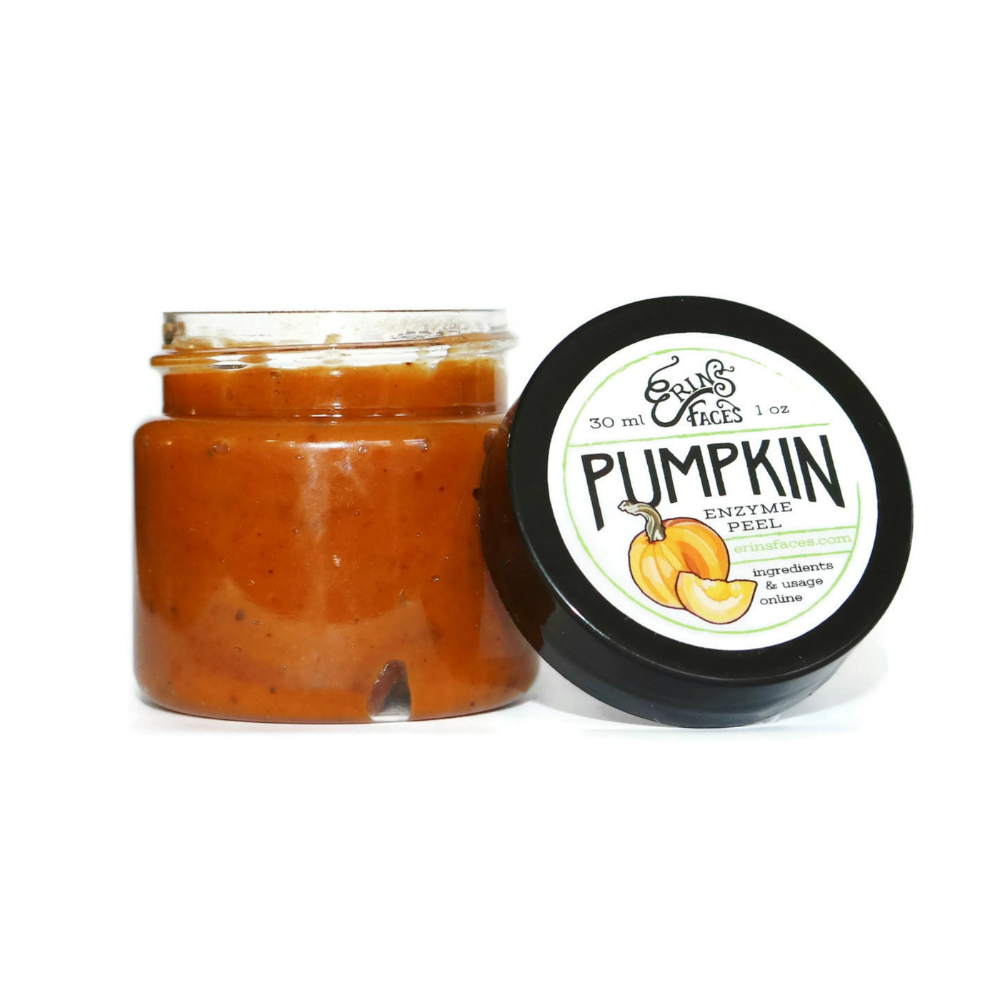 Brown pumpkin enzyme peel inside an opened mini cosmetic jar with lid on the side