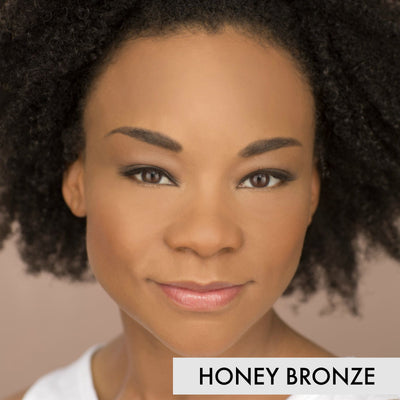 woman wearing the mineral liquid foundation in the color honey bronze