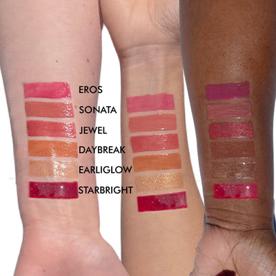 lip gloss swatches on three arms of various skintones